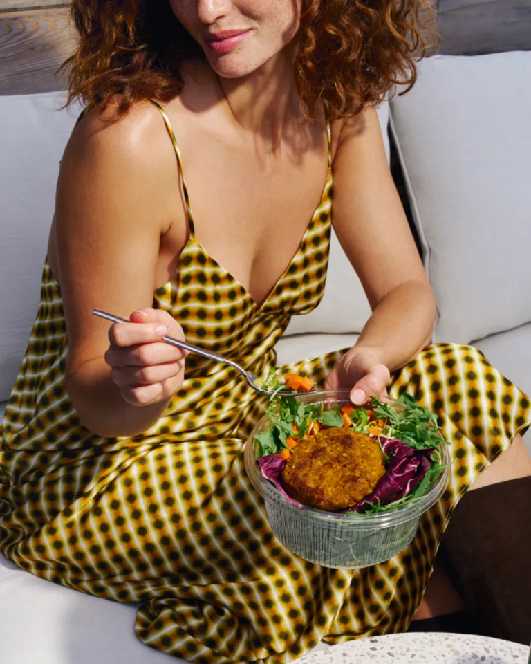 woman holding salad in lap