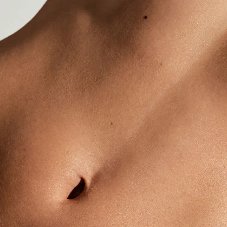 A close-up shot of a female's toned stomach