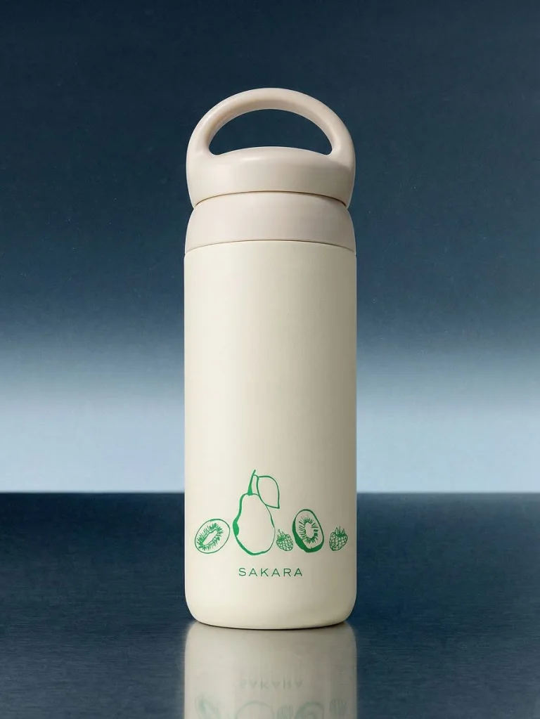 Sakara x Kinto 900mL Day Off Tumbler on a dark blue surface with light blue background