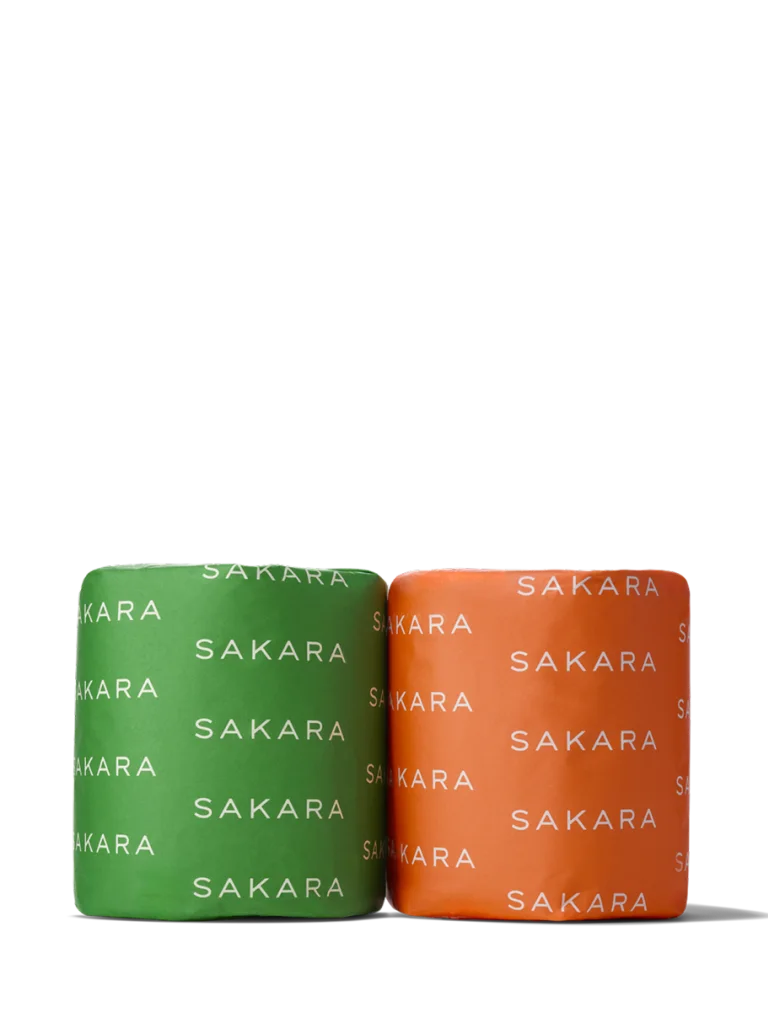 Two rolls of sakara toilet paper packaging against a white background