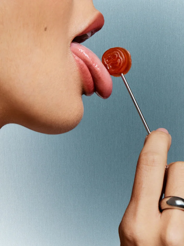 Woman licking a lolipop