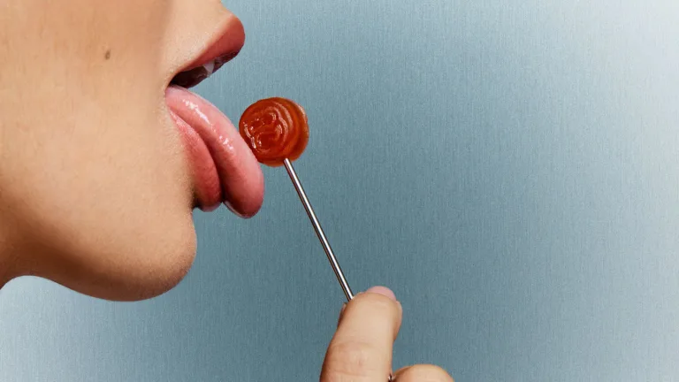 Woman licking a lolipop