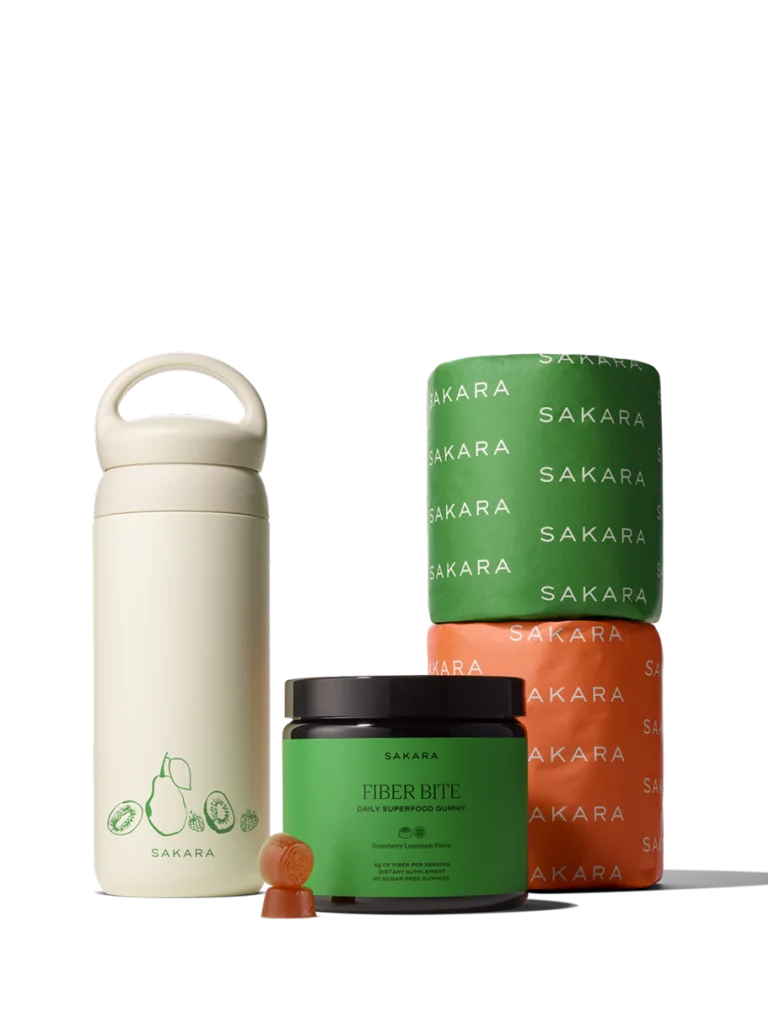 Sakara Fiber Bite, branded water bottle, and two branded toilet paper rolls