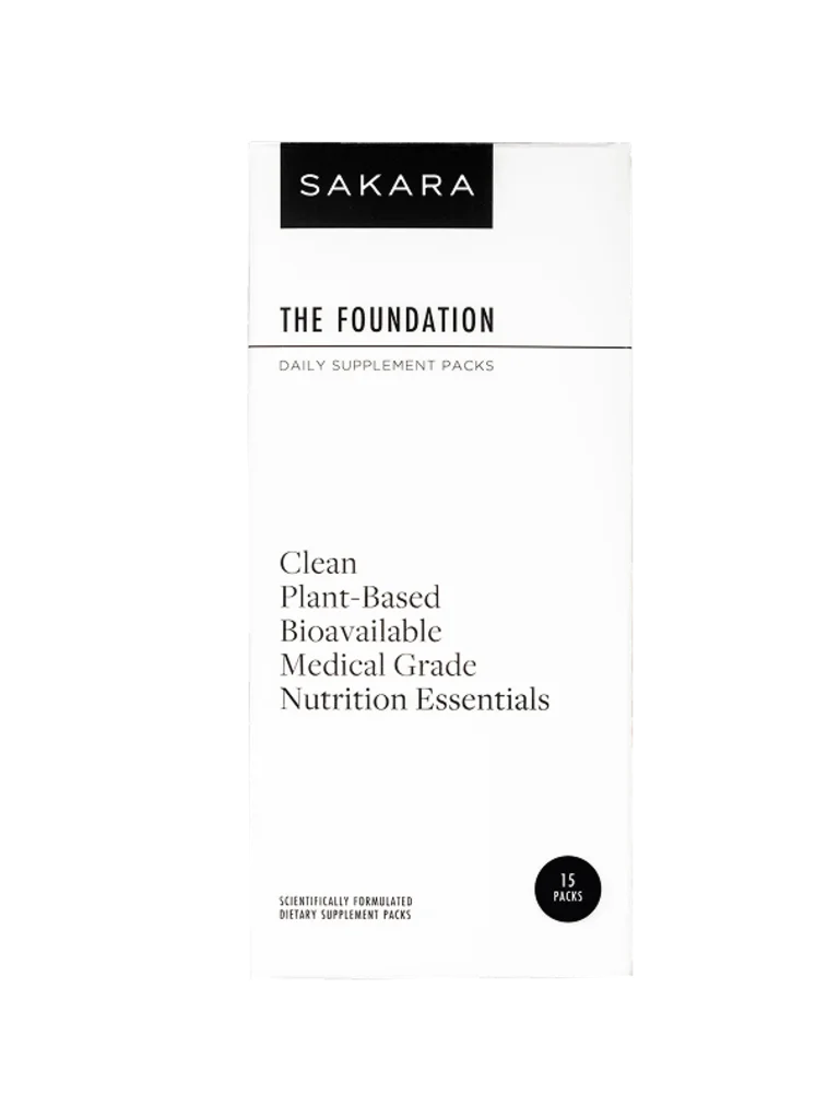Sakara The Foundation daily supplement packs in white box, 30 packs, labeled clean plant-based bioavailable medical grade nutrition essentials, displayed against a neutral background.