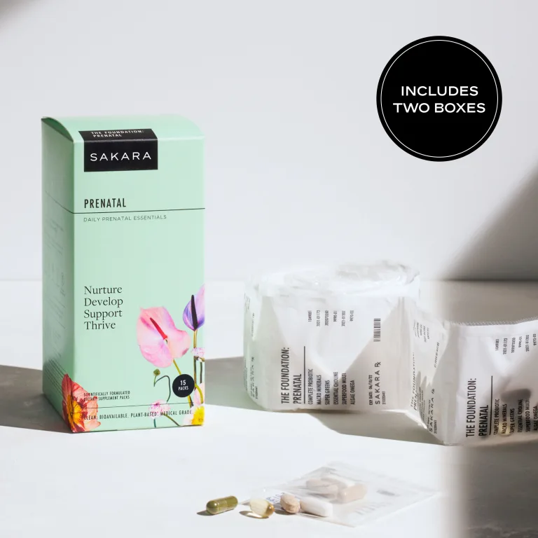 Sakara The Foundation: Prenatal daily supplement packs in mint green box, 30 packs, labeled Nurture Develop Support Thrive, shown with individual sachets and capsules on a neutral surface.